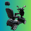 Black mobility scooter on a gradient blue to green background